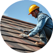 Roofer laying a roof in a bright blue sky, showcasing craftsmanship.