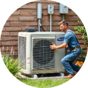 HVAC specialist servicing an outdoor air conditioning unit.